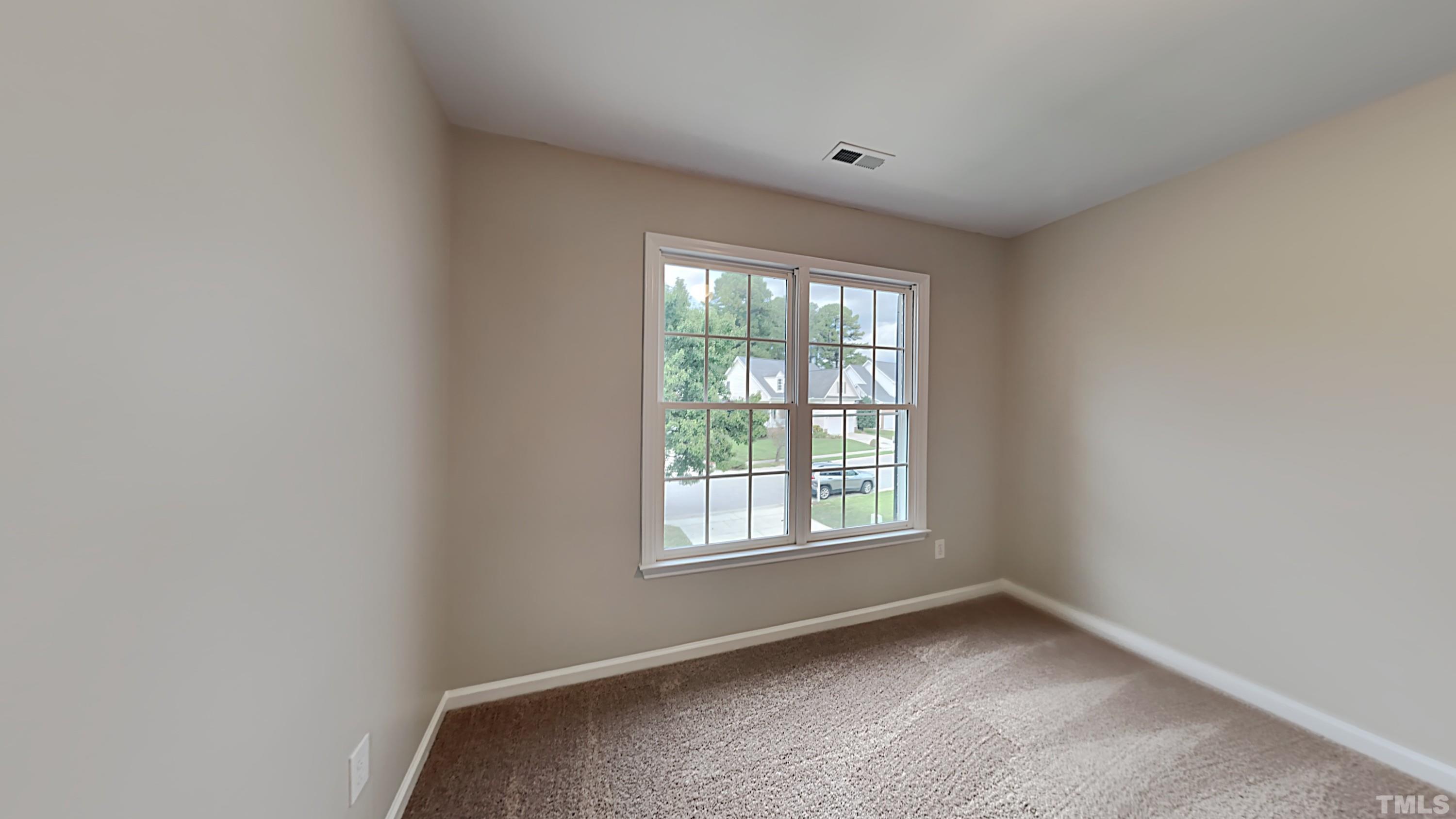 5020 Amberfield Way Raleigh, NC 27604 - Photo 21 of 24 a view of an empty room with a window