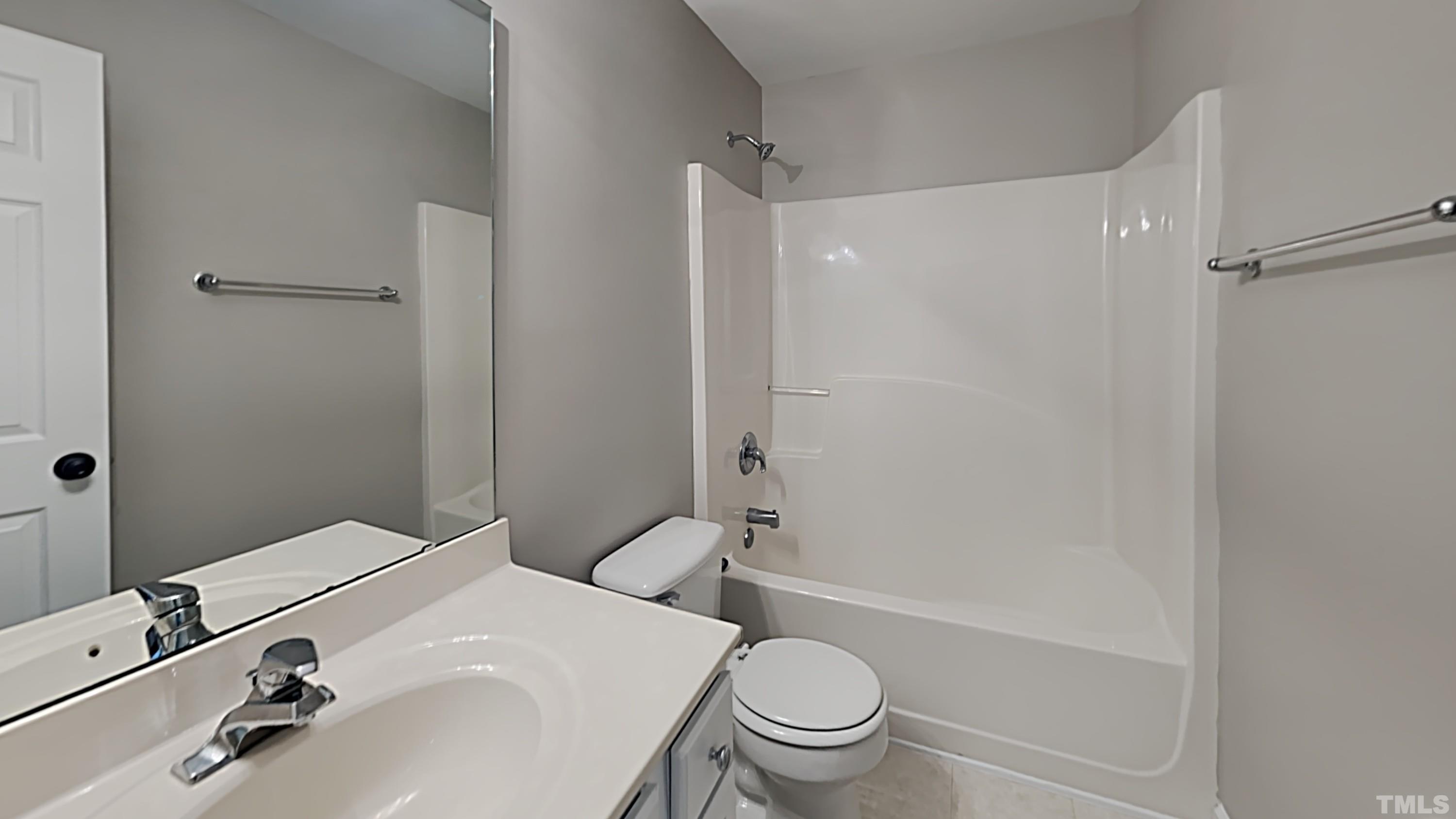 5020 Amberfield Way Raleigh, NC 27604 - Photo 23 of 24 a bathroom with a sink toilet and shower