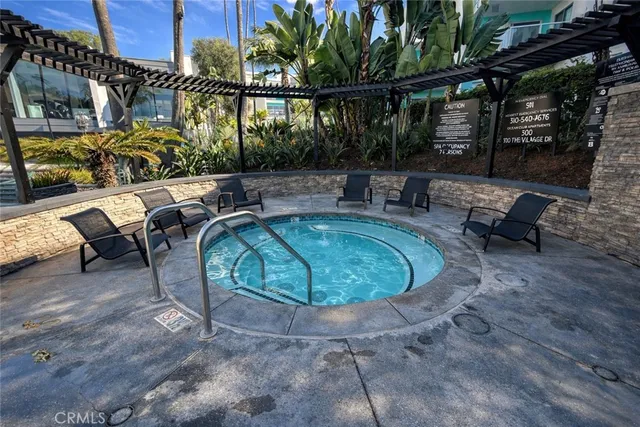 a view of a yard with plants and a bench
