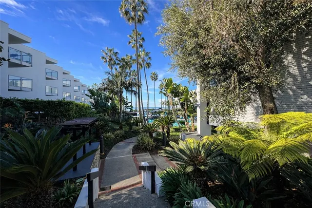 a dining room with furniture and a mirror