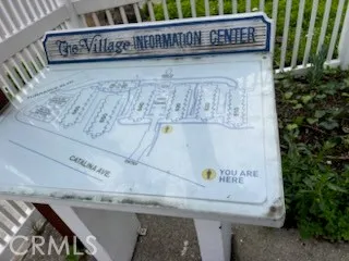 a utility room with dryer washer and a fridge