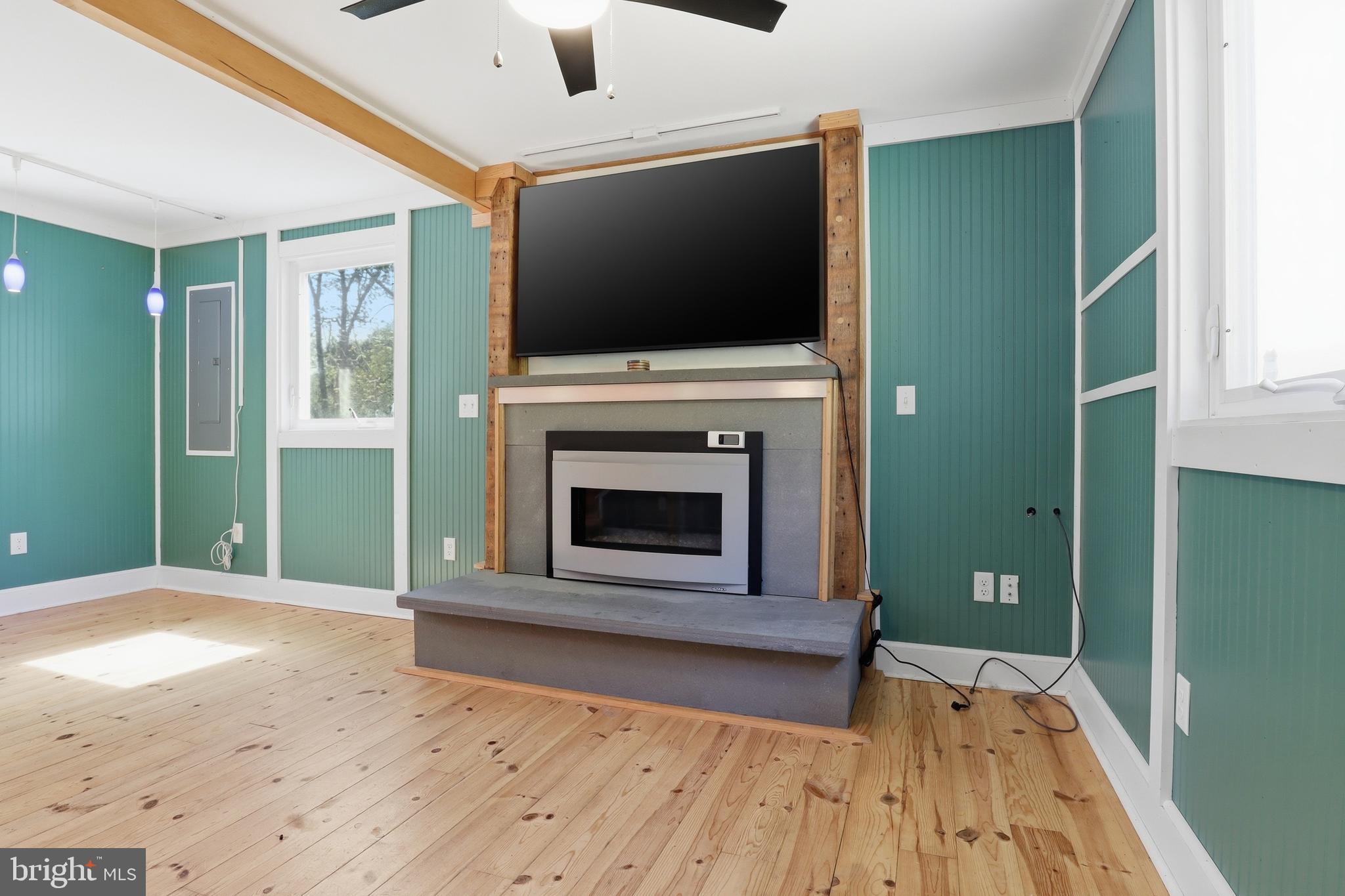 293 Grove Road Delta, PA 17314 - Photo 12 of 36 a view of a livingroom with an empty space and a fireplace