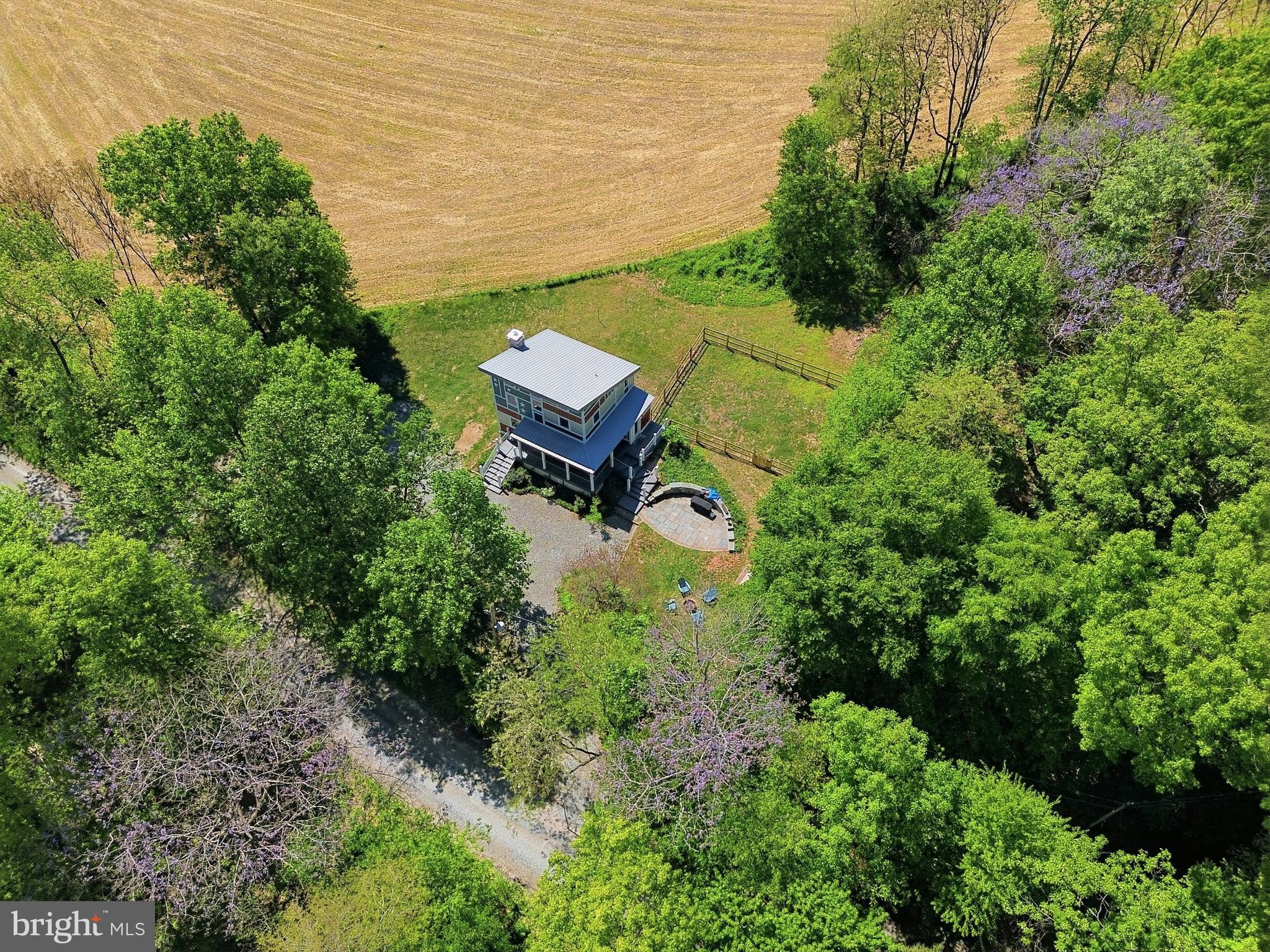293 Grove Road Delta, PA 17314 - Photo 31 of 36 an aerial view of a house with pool outdoor seating and green space