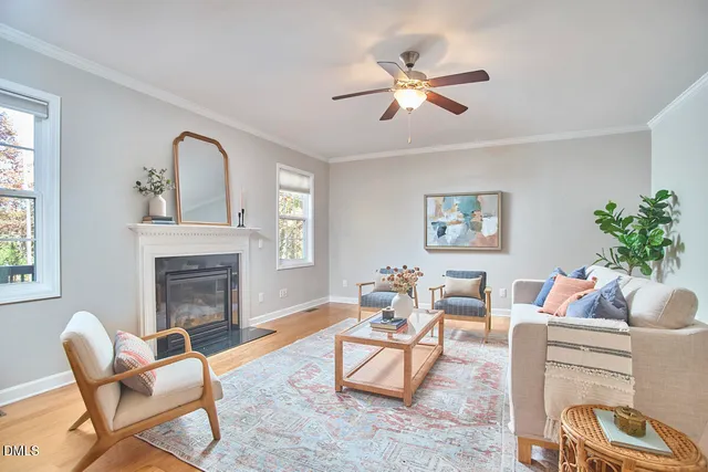 a living room with furniture dining table and a chandelier