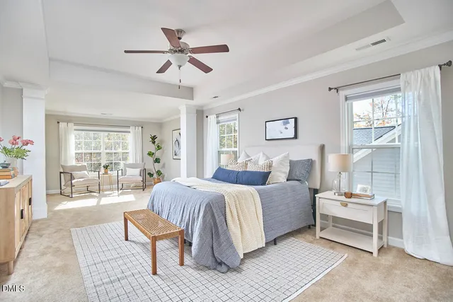 a living room with furniture and a window with garden view