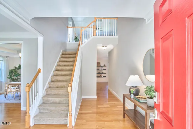 a view of entryway and hall with a mirror