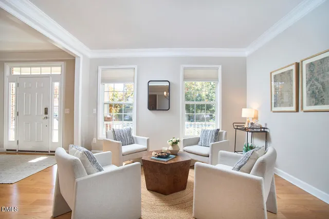 a table with a vase and flowers on it