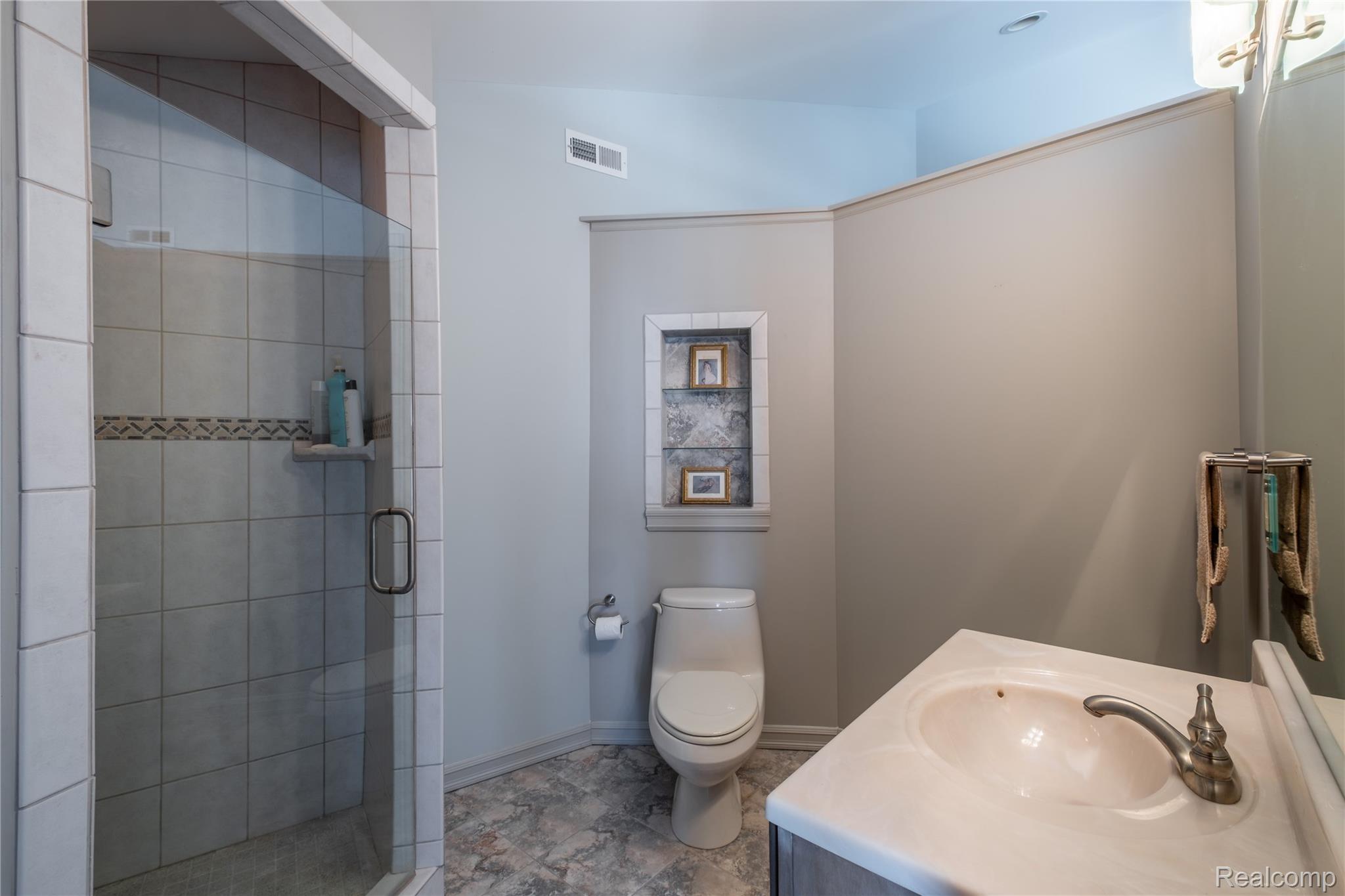 2350 Crane Road Fenton, MI 48430 - Photo 34 of 58 Bathroom featuring vanity and a stall shower
