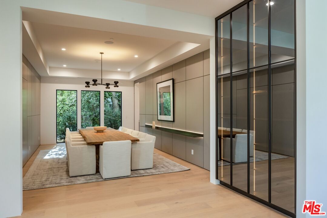17055 Rancho Street Encino, CA 91316 - Photo 24 of 73 a outdoor space with sliding door and wooden floor