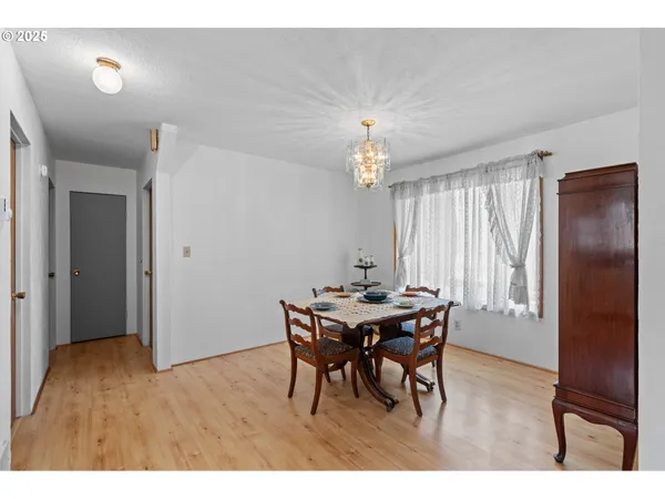 a view of a dining room with furniture and window