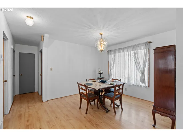a view of a dining room with furniture and window