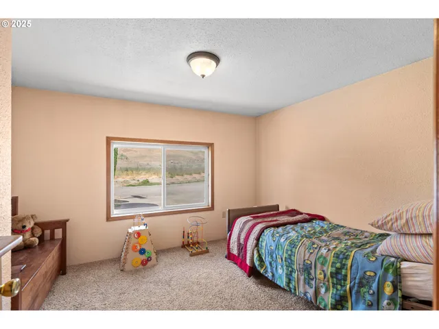 a bedroom with a bed and dresser