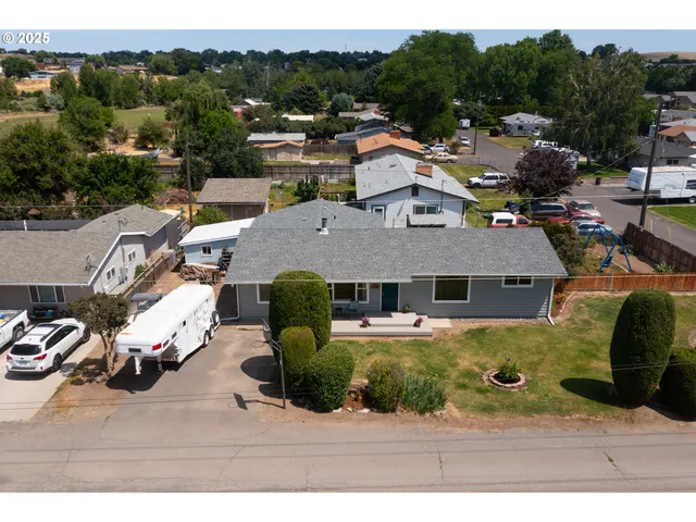 an aerial view of a house with a ocean view