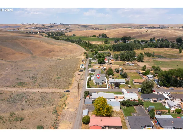 a kitchen with a sink stainless steel appliances and cabinets