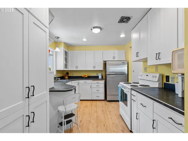 a kitchen with a washer and dryer