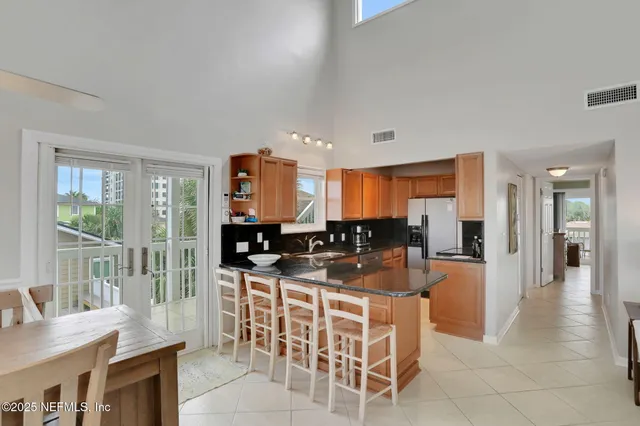 a kitchen with stainless steel appliances a stove a microwave and a refrigerator