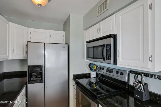 a view of a car park in front of a house