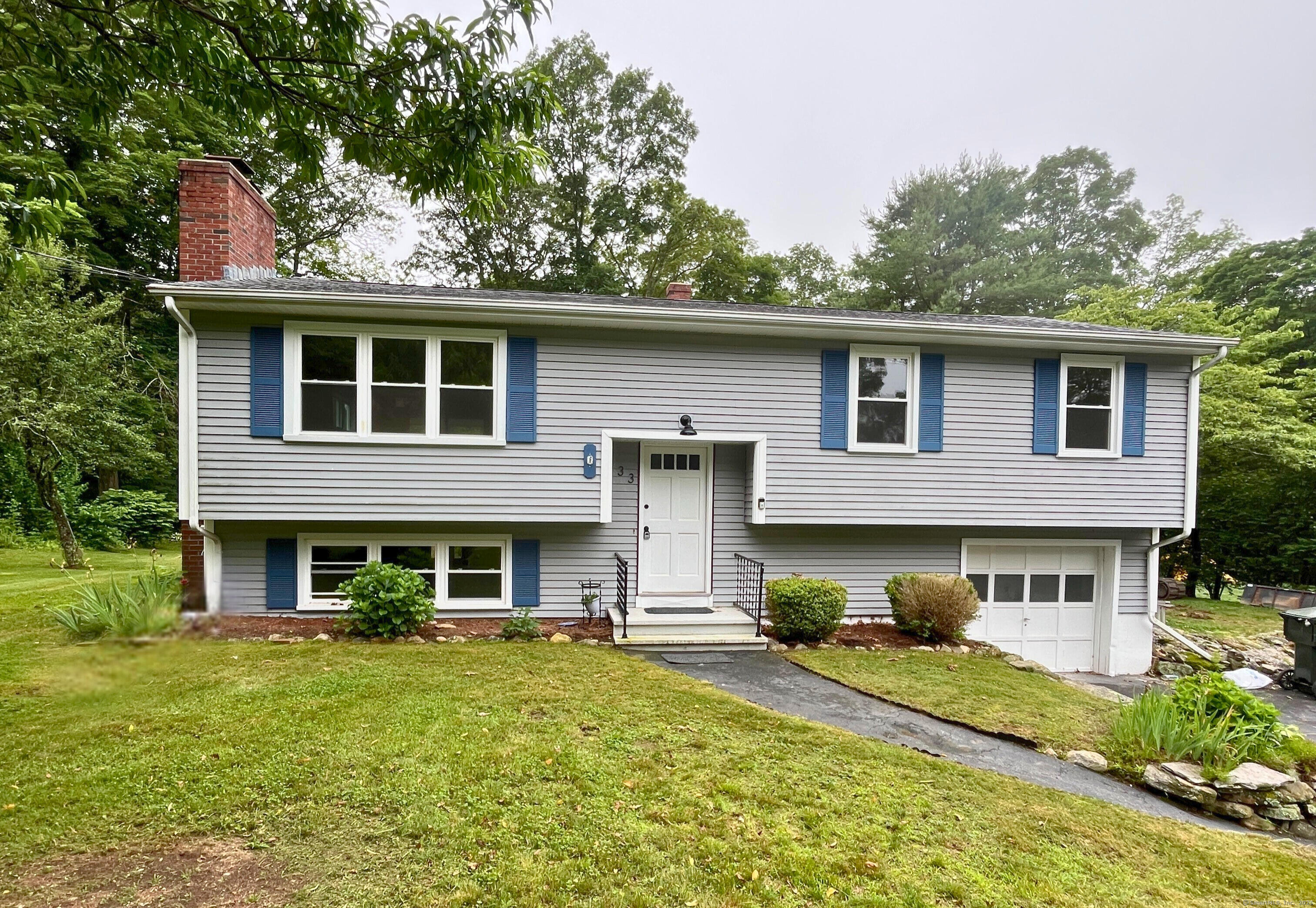 33 Forest Avenue Groton, CT 06355 - Photo 1 of 1 a front view of a house with a yard