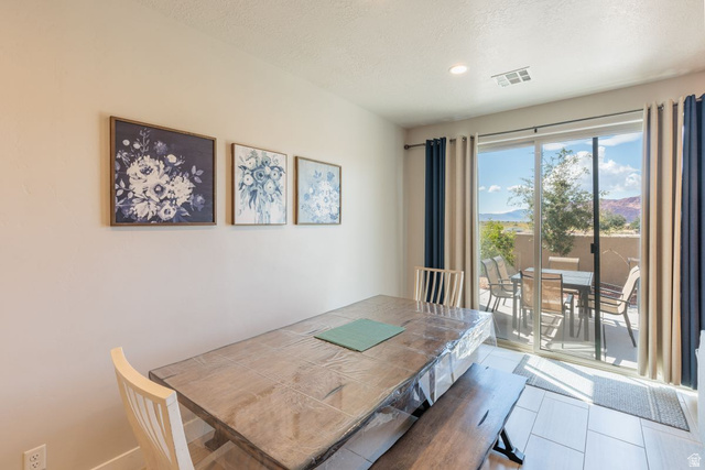 4845 Fishers Is Way St. George, UT 84770 - Photo 18 of 41 Dining room featuring a textured ceiling and a mountain view