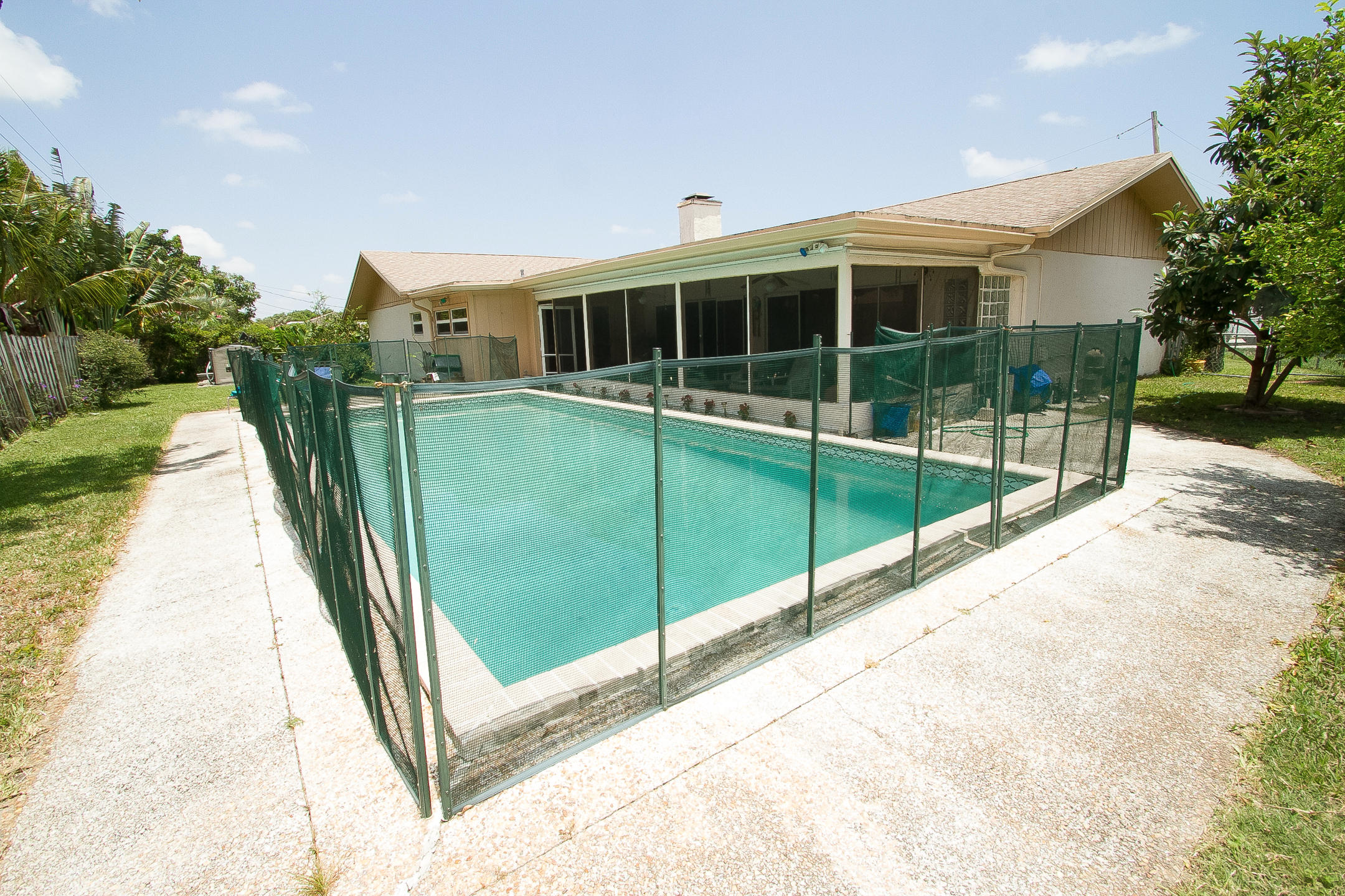 1011 Southwest 11th Terrace Boca Raton, FL 33486 - Photo 31 of 38 Pool with Safety Fence
