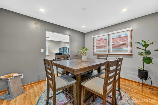 a view of a dining room with furniture and window