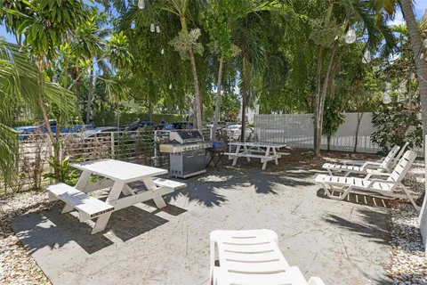 a view of a backyard with sitting area