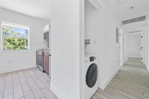 a view of a bathroom with washing machine