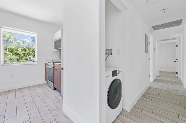 a view of a bathroom with washing machine