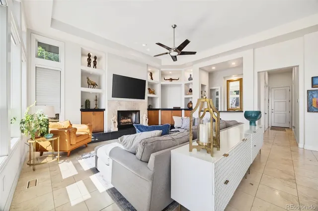 a living room with furniture fireplace and a flat screen tv