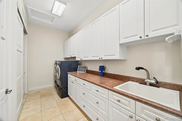 a kitchen with a sink and cabinets
