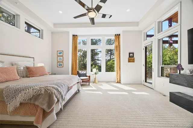 a spacious bedroom with a large bed and a large window