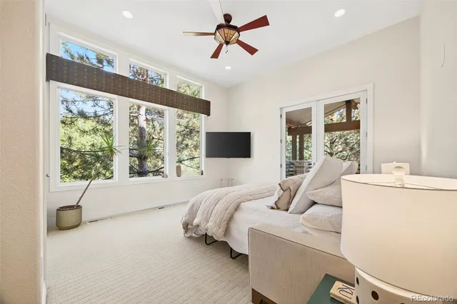 a bathroom with a sink double vanity mirror and a shower