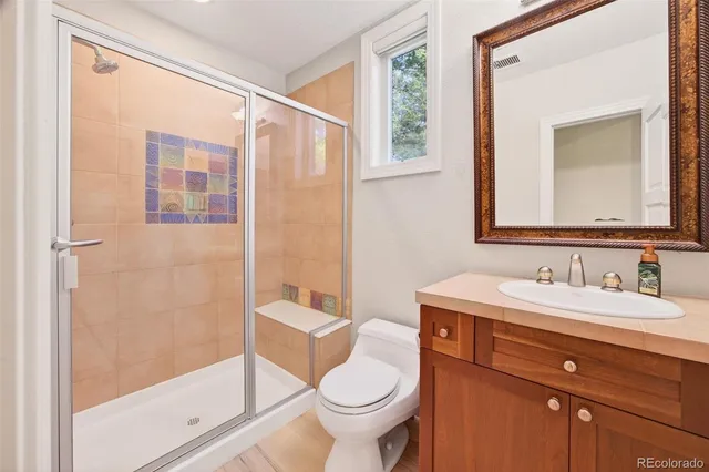 a living room with a couch and a wooden floor