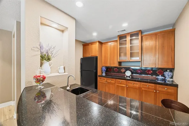 a room with pool table and windows