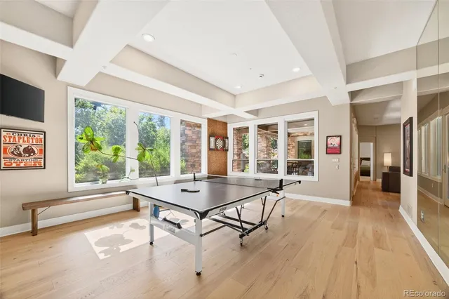 a bedroom with a bed and glass window