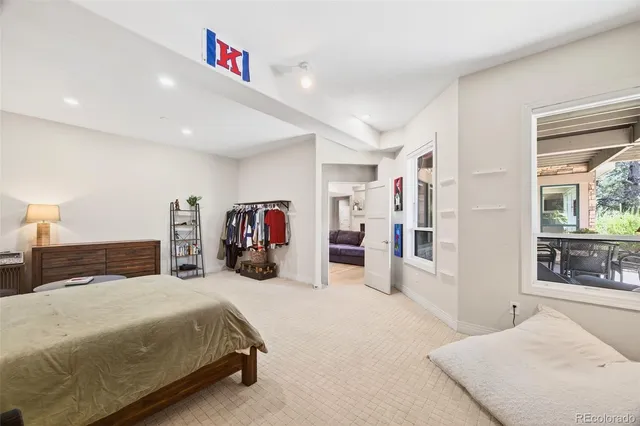 a bathroom with a granite countertop sink a mirror a bathtub and shower