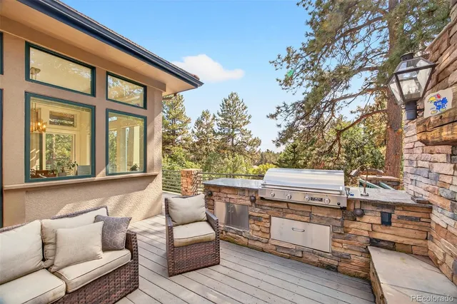 a balcony with furniture and a fireplace