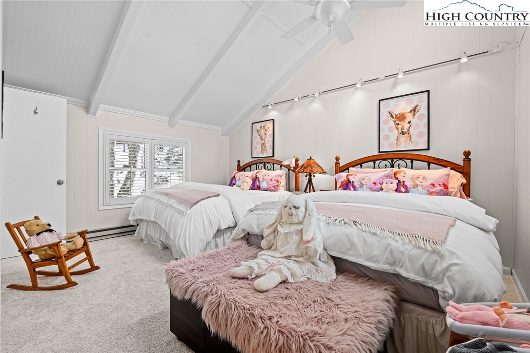 123 St Andrews Road Beech Mountain, NC 28604 - Photo 16 of 50 a bedroom with a bed and a window