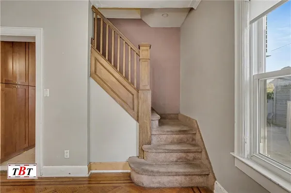 a view of entryway with wooden floor