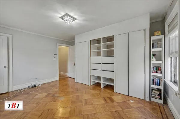 a view of an empty room with a closet