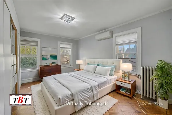 a bedroom with a large bed and a window
