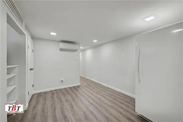 an empty room with wooden floor