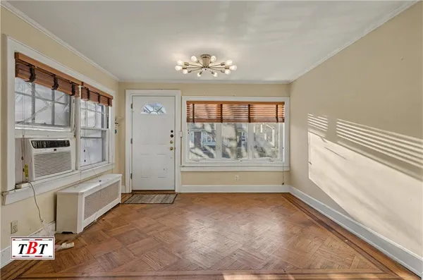 a view of an empty room with a window