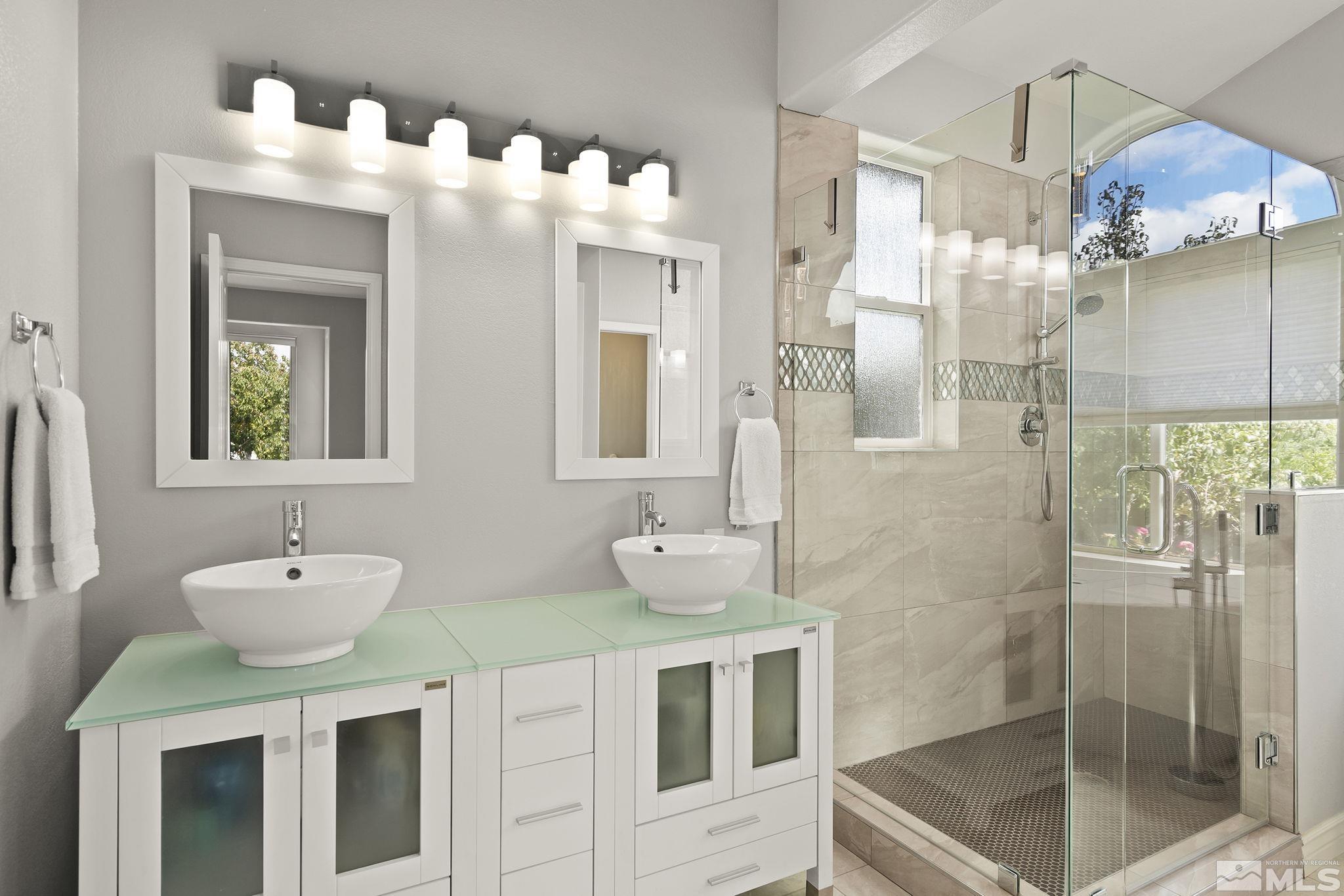 3285 Marthiam Avenue Reno, NV 89509 - Photo 20 of 40 a bathroom with a sink mirror and shower