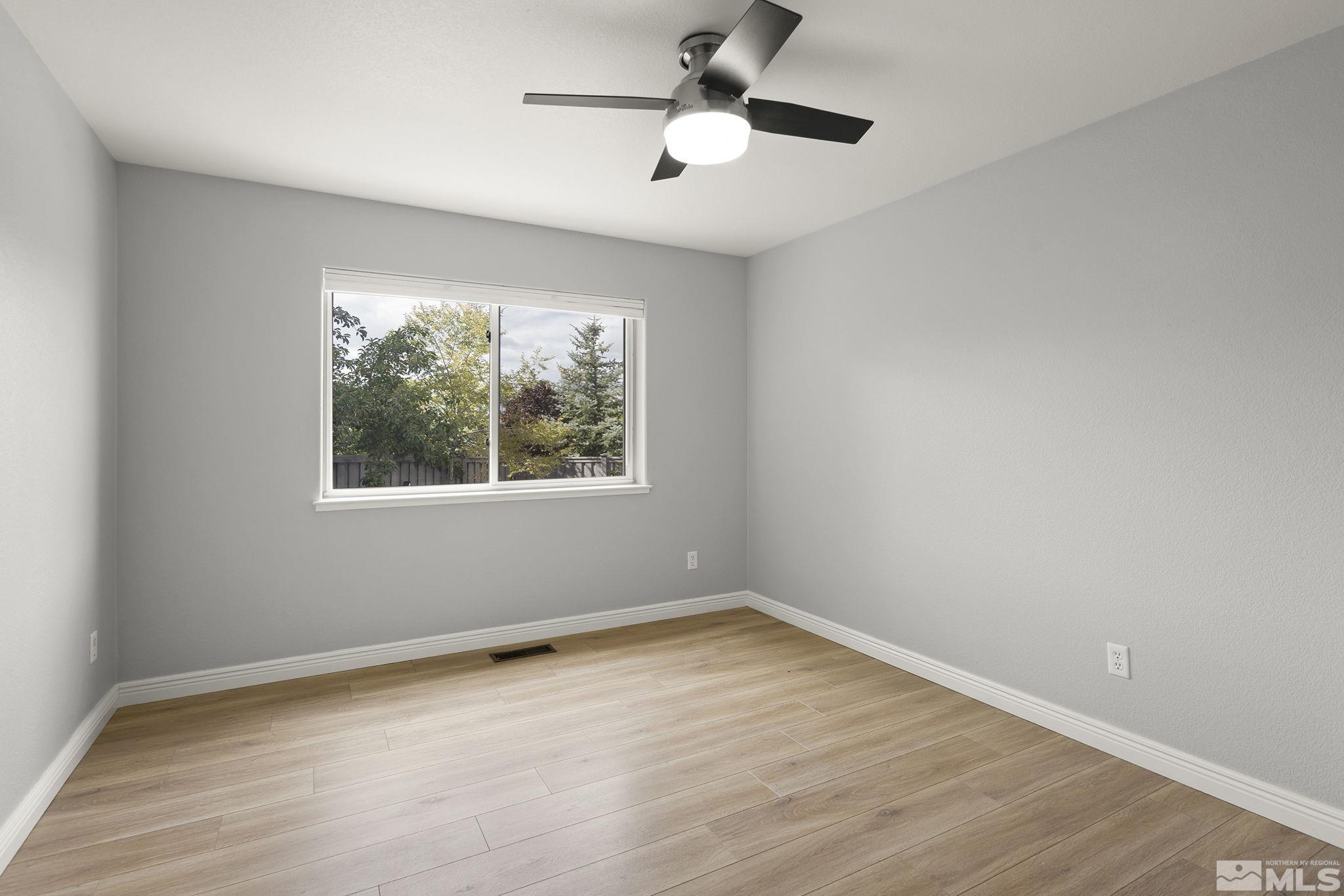 3285 Marthiam Avenue Reno, NV 89509 - Photo 24 of 40 wooden floor in an empty room with a window