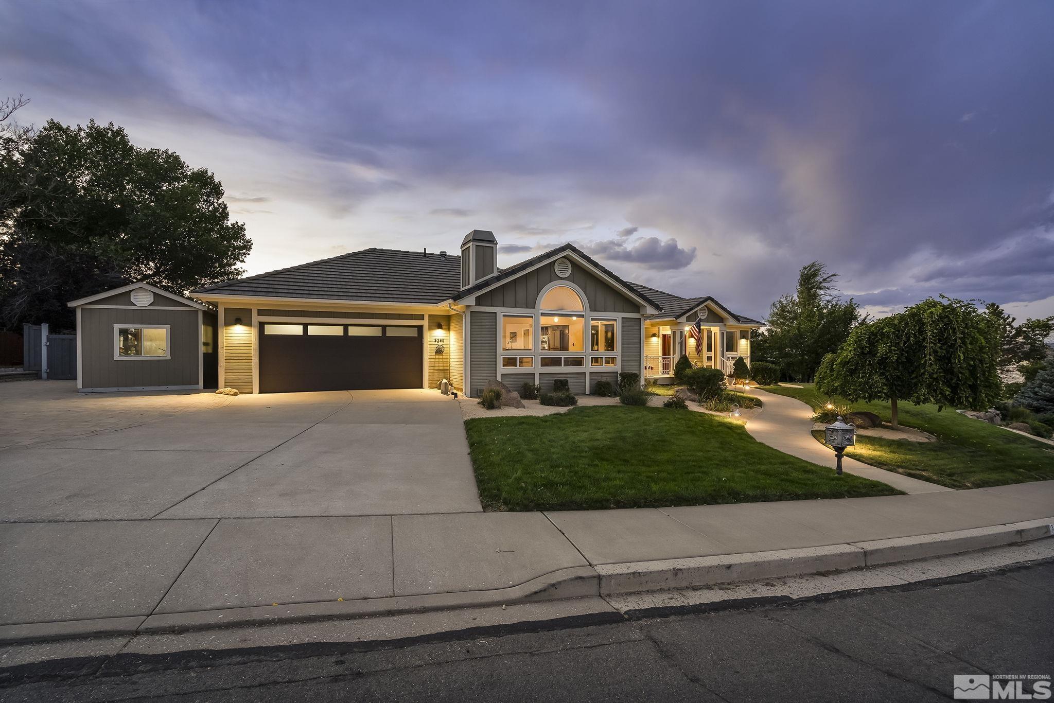 3285 Marthiam Avenue Reno, NV 89509 - Photo 3 of 40 a front view of a house with garden