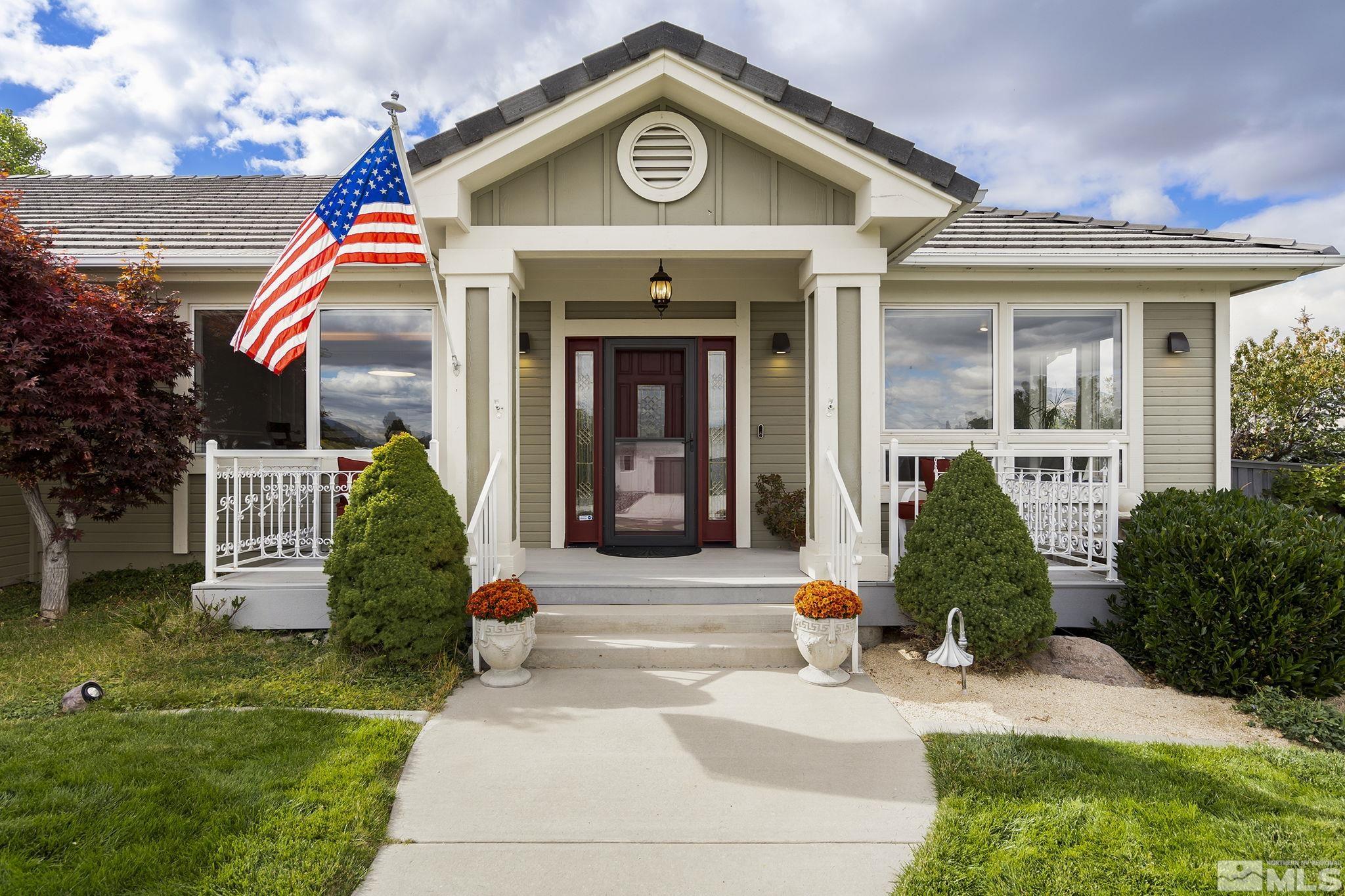 3285 Marthiam Avenue Reno, NV 89509 - Photo 5 of 40 a front view of a house with garden