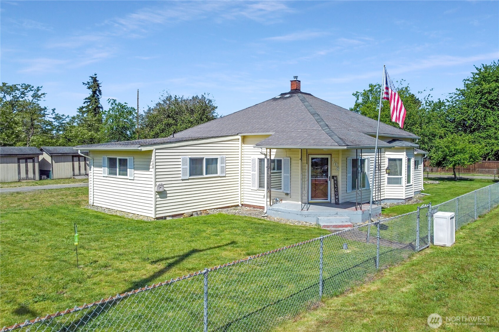 a front view of house with yard and green space
