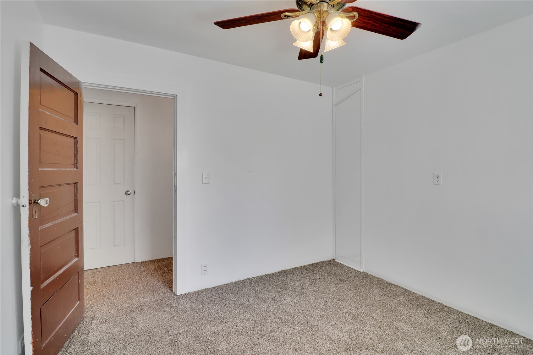 108 2nd Street Southeast Rainier, WA 98576 - Photo 18 of 40 an empty room with a chandelier fan
