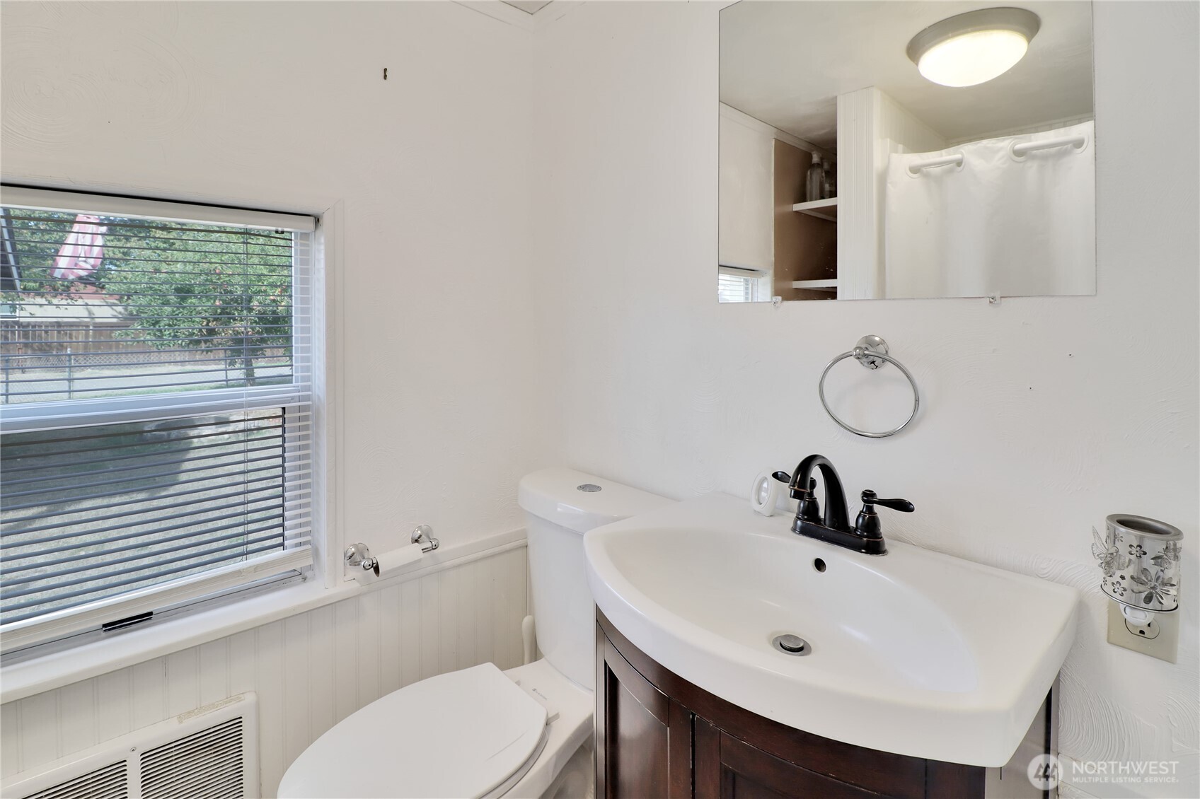 108 2nd Street Southeast Rainier, WA 98576 - Photo 22 of 40 a bathroom with a sink a toilet and mirror